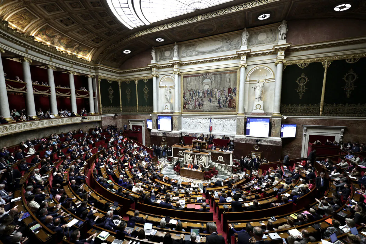 Deputies applaud the adoption of the bill on the right to assistance in dying following the vote at the National Assembly, France's lower house parliament, in Paris on May 27, 2025. (Stephane de Sakutin/AFP via Getty Images)