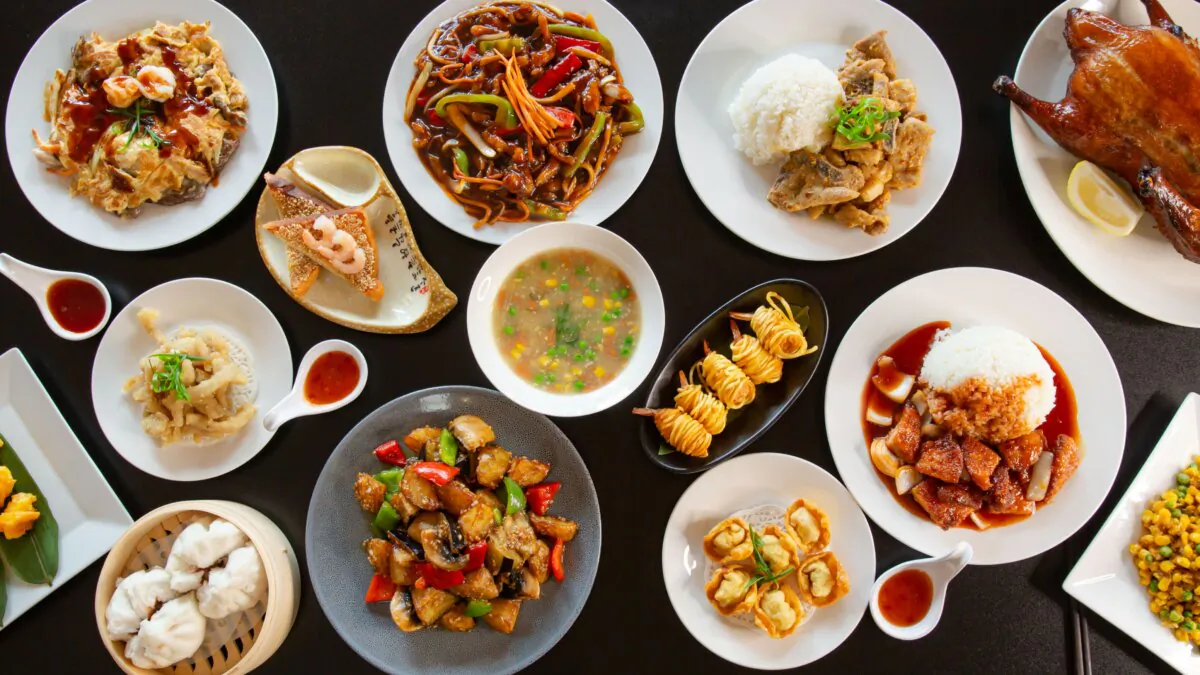 Asian food often consists of many dishes that everyone shares. (AuthorLinyt Photography/Shutterstock)