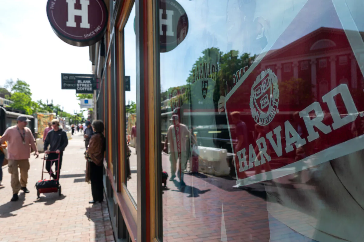 People walk near Harvard University in Cambridge, Mass., on May 28, 2025. (Photo by Spencer Platt/Getty Images)