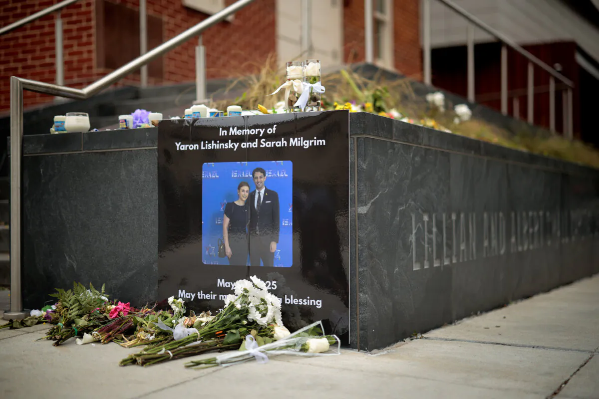 A photograph of Sarah Lynn Milgrim and Yaron Lischinsky is displayed outside the Lillian and Albert Small Capital Jewish Museum in Washington on May 29, 2025. (Chip Somodevilla/Getty Images)