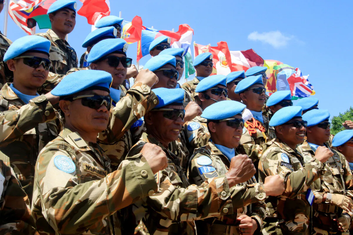 Peacekeeping troops from the United Nation Interim Forces In Lebanon (UNIFIL) commemorate the 77th anniversary of U.N. Peacekeepers Day in the forces headquarters' base in the southern Lebanese village of Naqoura on May 29, 2025. (Mahmoud Zayyat/AFP via Getty Images)