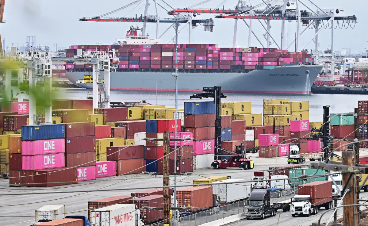 The Seattle Bridge container ship, sailing under a Panamanian flag, is seen in the background behind stacked containers in the Port of Los Angeles, on May 6, 2025. (Frederic J. Brown/AFP via Getty Images)
