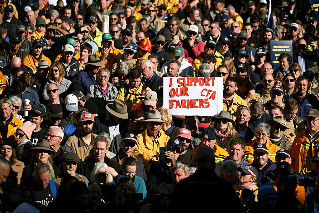 Thousands of farmers and volunteer firefighters gather outside Victoria's State Parliament to protest against the new levy, in Melbourne, Australia, on May 20, 2025. (William West/AFP via Getty Images)