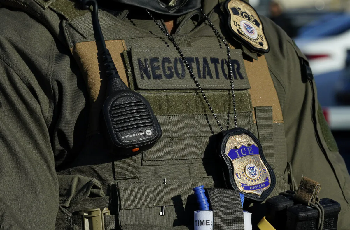 Immigration and Customs Enforcement (ICE) agents stand near a gate at Delaney Hall, a newly converted immigrant detention centre in Elizabeth, N.J., on May 7, 2025. (Timothy A. Clary/AFP via Getty Images)