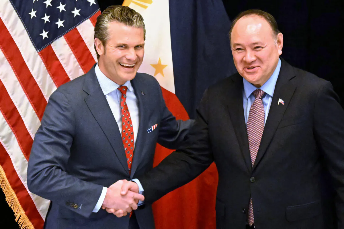 U.S. Secretary of Defense Pete Hegseth (L) shakes hands with the Philippines Secretary of National Defense Gilberto Teodoro before a bilateral meeting on the sidelines of the Shangri-La Dialogue Summit in Singapore on May 30, 2025. (Mohd Rasfan/AFP via Getty Images)