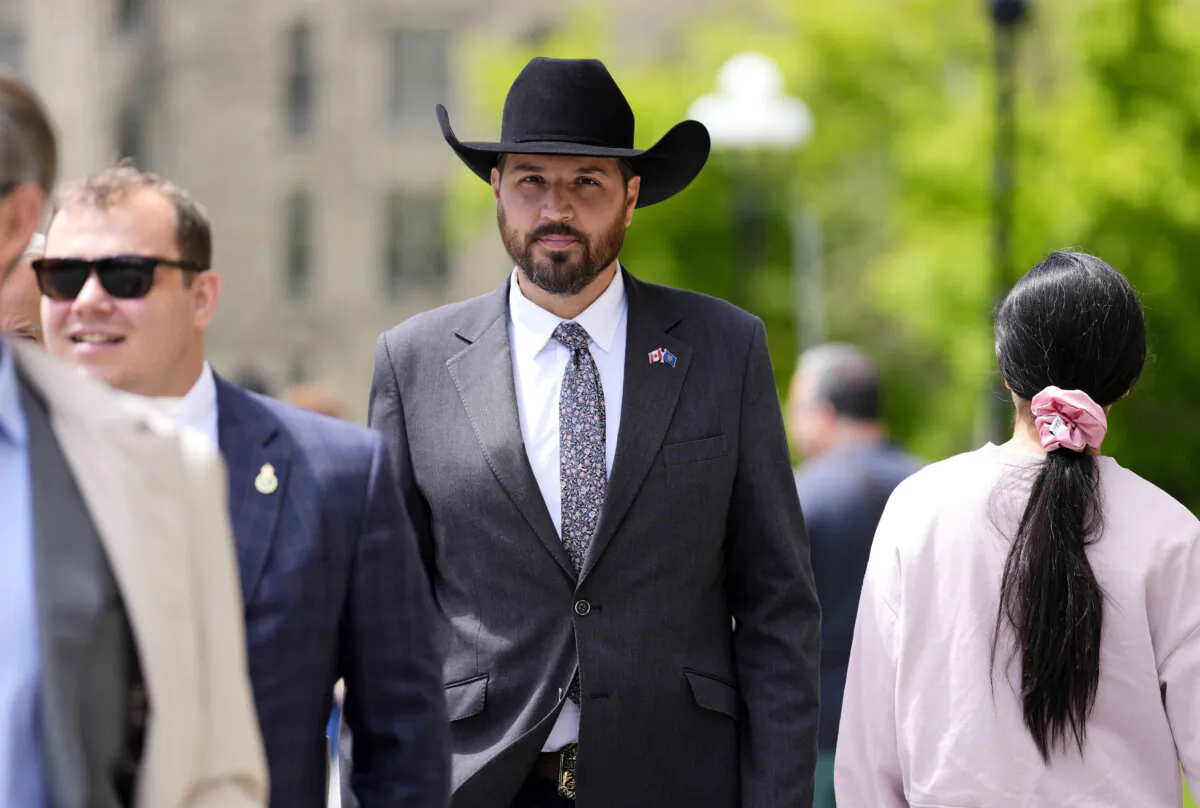 Conservative MP Damien Kurek, who announced he would give up his Alberta seat to allow Tory Leader Pierre Poilievre to run in a byelection in his riding, arrives for a meeting of the Conservative caucus on Parliament Hill in Ottawa on May 25, 2025. (The Canadian Press/Justin Tang)