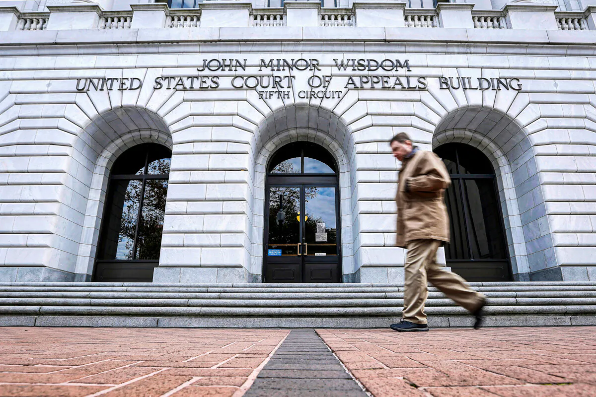 A man walks in front of the Fifth U.S. Circuit Court of Appeals in New Orleans in this undated file photograph. (Jonathan Bachman/AP Photo)