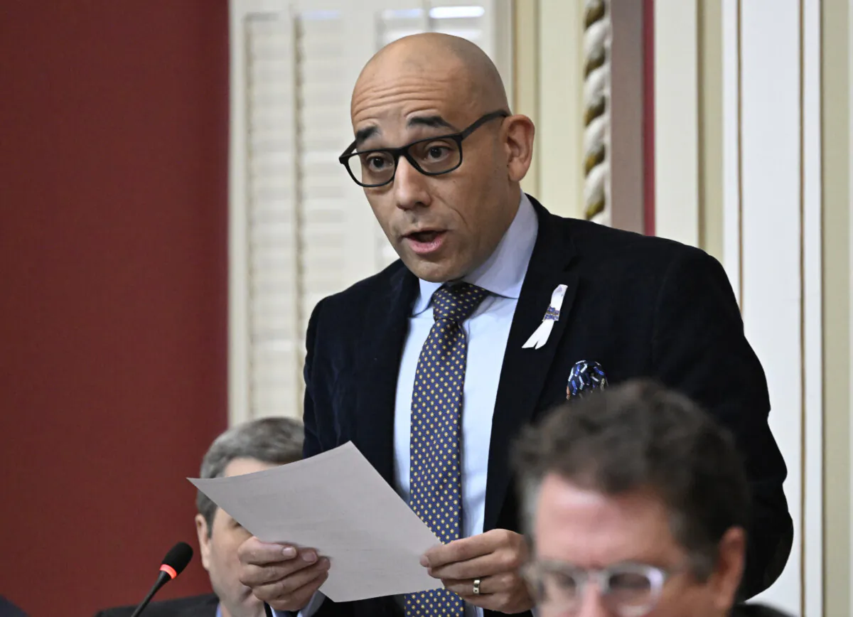 Quebec Minister for the Economy, Minister Responsible for the Fight Against Racism Christopher Skeete tables a legislation at the legislature in Quebec City, on Dec. 4, 2024. (The Canadian Press/Jacques Boissinot) 