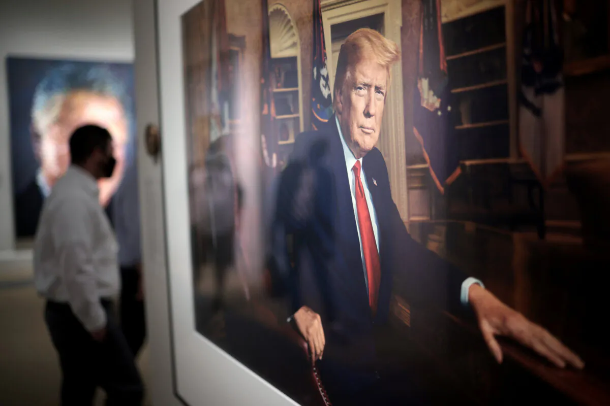 Patrons view a portrait of former U.S. President Donald Trump in the America’s Presidents exhibition at the National Portrait Gallery as the Smithsonian Institution begins to slowly re-open its museums in Washington on May 14, 2021. Trump’s portrait, a photograph made by Pari Dukovic, is on display to the public for the first time since the closure of the museums due to the coronavirus pandemic. (Win McNamee/Getty Images)