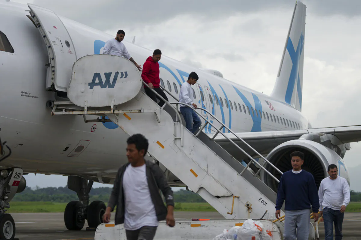 Hondurans who were deported from the United States deplane at Ramon Villeda Morales Airport, in San Pedro Sula, Honduras, on Dec. 4, 2024. (Moises Castillo/AP Photo)