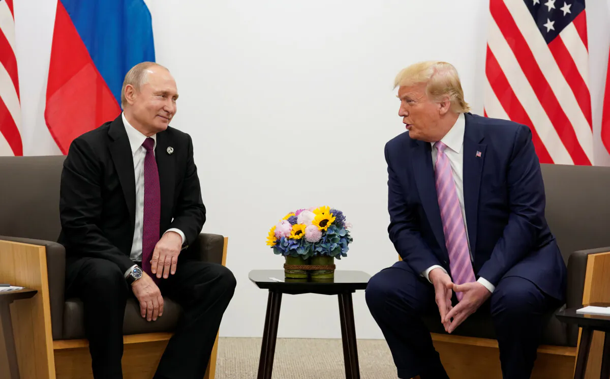 Russian President Vladimir Putin and U.S. President Donald Trump talk during a bilateral meeting at the G20 leaders summit in Osaka, Japan, on June 28, 2019. REUTERS/Kevin Lamarque/File Photo