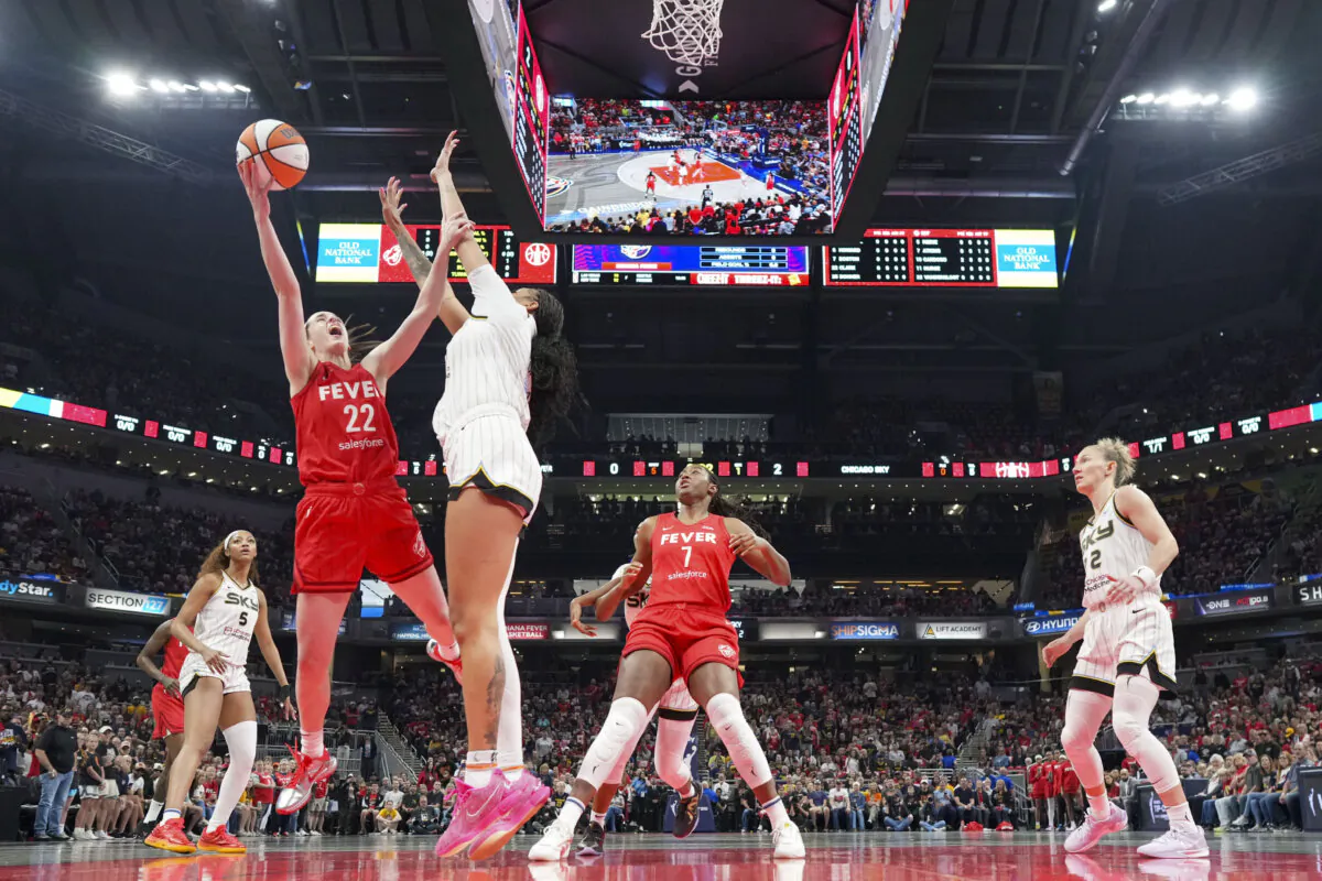 Indiana Fever guard Caitlin Clark (22) shoots around Chicago Sky center Kamilla Cardoso (10) during the first half of an WNBA basketball game in Indianapolis, Saturday, May 17, 2025. (AJ Mast/AP Photo)