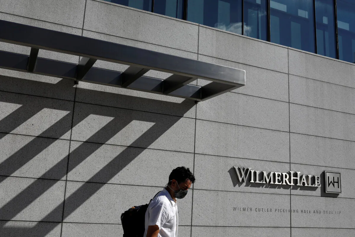 A man outside of the law firm WilmerHale in Washington on Aug. 30, 2020. (Andrew Kelly/Reuters) 