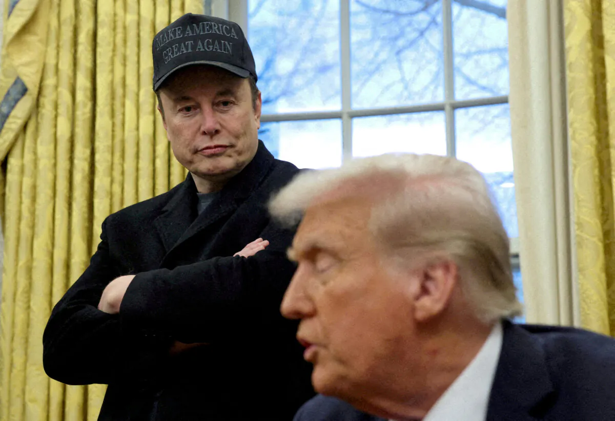 Tesla CEO Elon Musk (L) listens to President Donald Trump (R) speak in the Oval Office on Feb. 11, 2025. (Kevin Lamarque/Reuters)