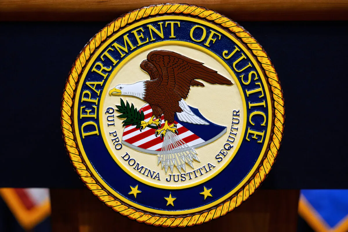 The Department of Justice logo on a podium before a press conference at the Justice Department in Washington on May 6, 2025. (Julia Demaree Nikhinson/AP Photo)