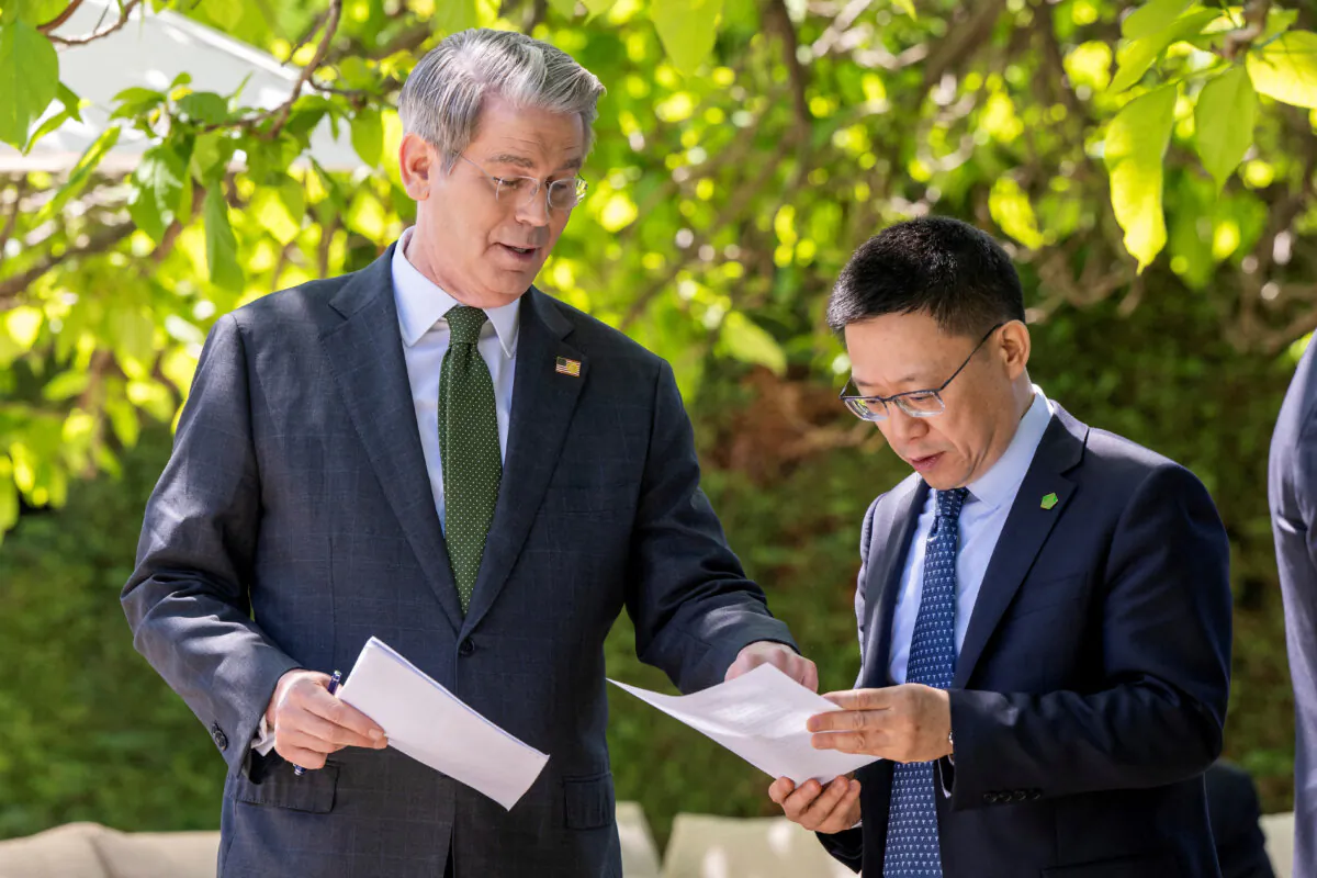 U.S. Secretary of the Treasury Scott Bessent speaks with Chinese Vice Minister of Finance Liao Min on the day of a bilateral meeting between the United States and China in Geneva on May 11, 2025. (Keystone/EDA/Martial Trezzini/Handout via Reuters)
