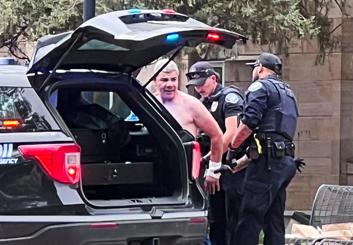 Law enforcement officers detain suspect Mohamed Soliman after an attack that injured multiple people, in Boulder, Colo., on June 1, 2025. (X/@OpusObscuraX/via Reuters)