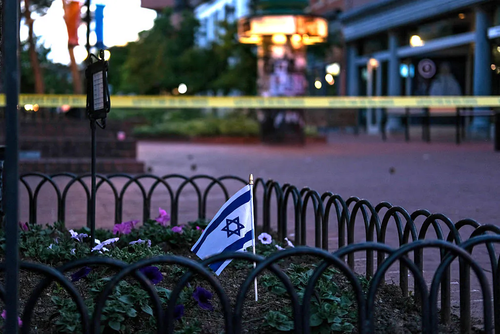 An Israeli flag in a flower bed at the Pearl Street crime scene, where what the FBI called a “targeted terror attack” took the life of an elderly Jewish demonstrator and wounded five others, in Boulder, Col. on June 1, 2025. (Eli Imadali / AFP via Getty Images)