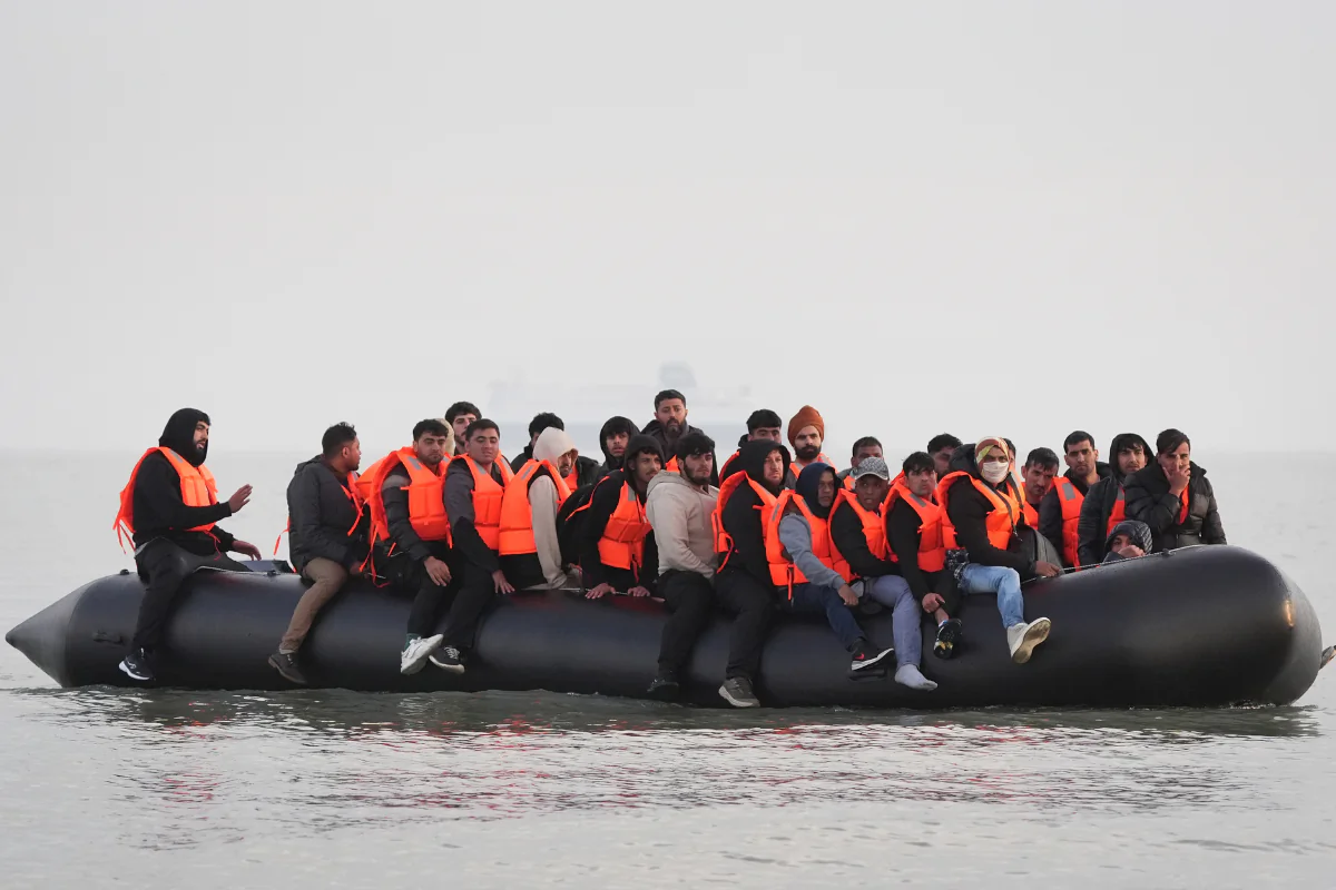 A group of immigrants onboard a small boat leaving the beach attempting to reach the UK by crossing the English Channel, in Gravelines, France, on May 31, 2025. (Gareth Fuller/PA Wire)