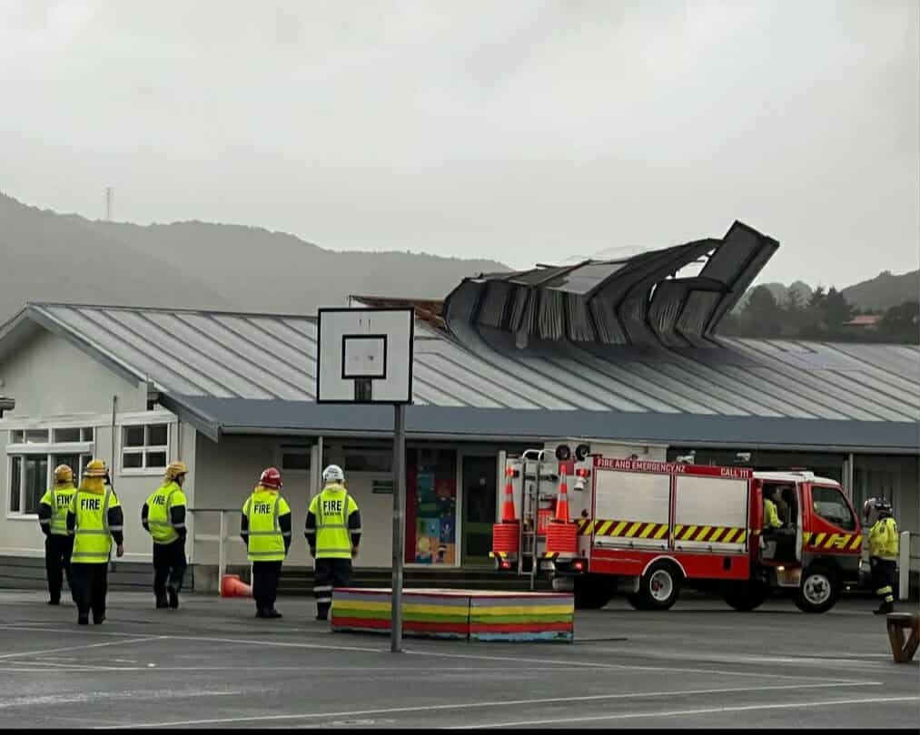 Emergency services workers inspect the damage to Konini School, in the Wellington suburb of Wainuiomata, which lost much of its roof during storms which hit the country on June 5, 2025. (Supplied)