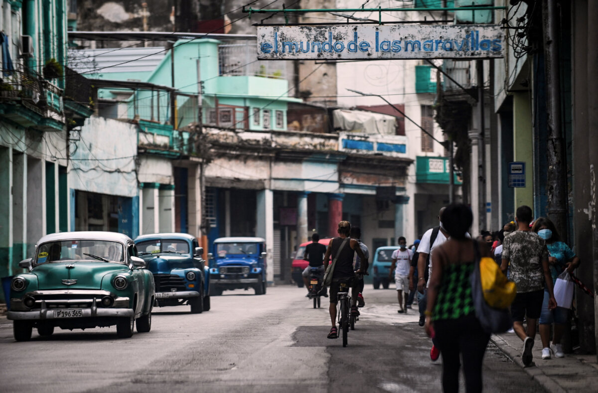 Cubans walk along a street in Havana, on July 15, 2021. (Yamil Lage/AFP via Getty Images)