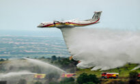 Day in Photos: Firefighting Demonstration, Casting Ballots in Burundi, and Gendarme Dog