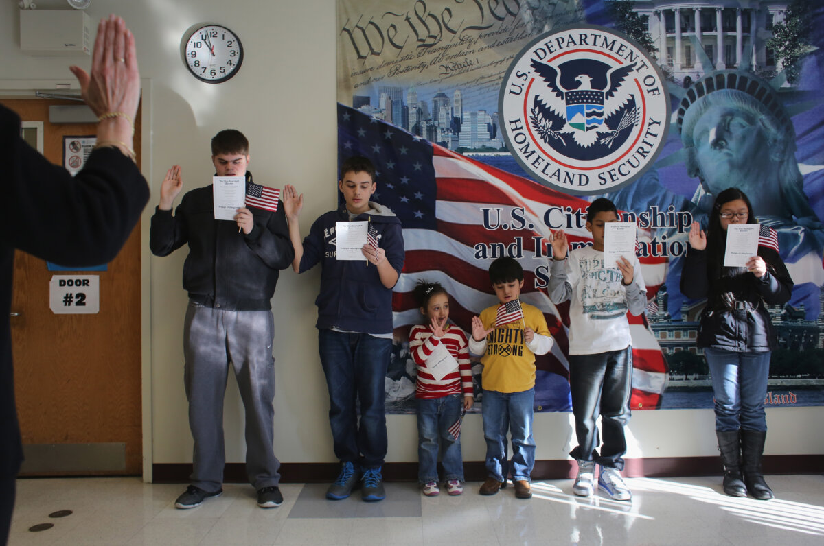 Children participate in a U.S. citizenship ceremony at the U.S. Citizenship and Immigration Services district office in New York City on Jan. 29, 2013. (John Moore/Getty Images)