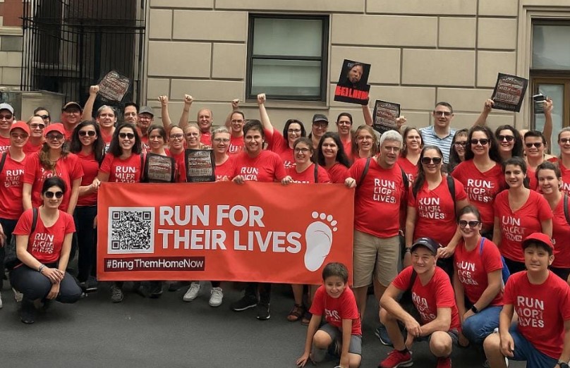 The Run for Their Lives group, which supports people being held hostage in Gaza, participates in the Israel Day Parade in New York City on May 18, 2024. (Courtesy of Shira Weiss/Run for Their Lives)