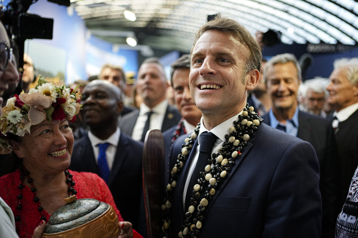 French President Emmanuel Macron (R) visits the French Polynesia stand at La Baleine (The Whale) exhibition centre in Nice, France, on June 8, 2025. (Laurent Cipriani//AFP via Getty Images)