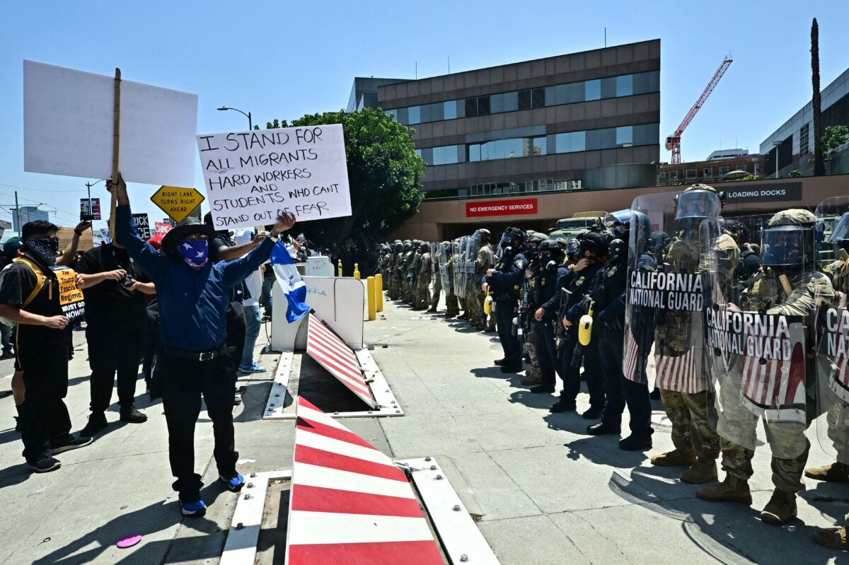 Protesters confront with National Guard soldiers and U.S. Department of Homeland Security (DHS) Police officers in downtown Los Angeles, Calif., on June 8, 2025. (Frederic J. Brown/AFP via Getty Images)