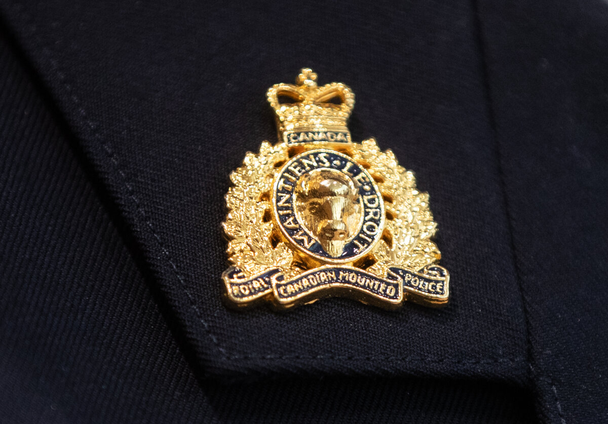 An RCMP collar tab pin is seen in Edmonton, on Feb. 5, 2025. (The Canadian Press/Jason Franson)