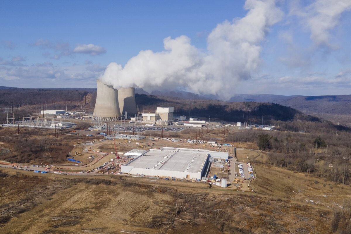 A data center owned by Amazon Web Services, front, is under construction next to the Susquehanna nuclear power plant in Berwick, Pa., on Jan. 14, 2024. (Ted Shaffrey/AP Photo)
