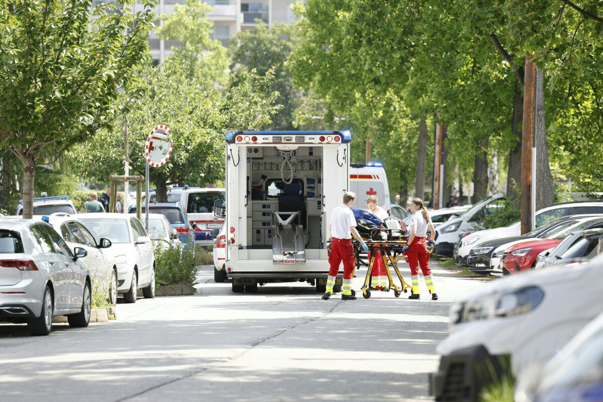Paramedics a next to an ambulance car close to a school where, according to reports, several people died in a shooting, on June 10, 2025 in Graz, southeastern Austria. (Photo by ERWIN SCHERIAU/APA/AFP via Getty Images)