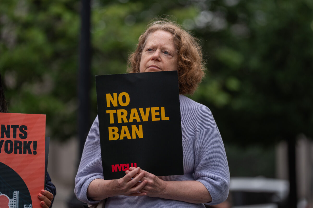 People attend a rally and press conference organised by the New York Immigration Coalition (NYIC) against President Donald Trump's new travel ban in New York City on June 9, 2025. (Adam Gray/Getty Images)