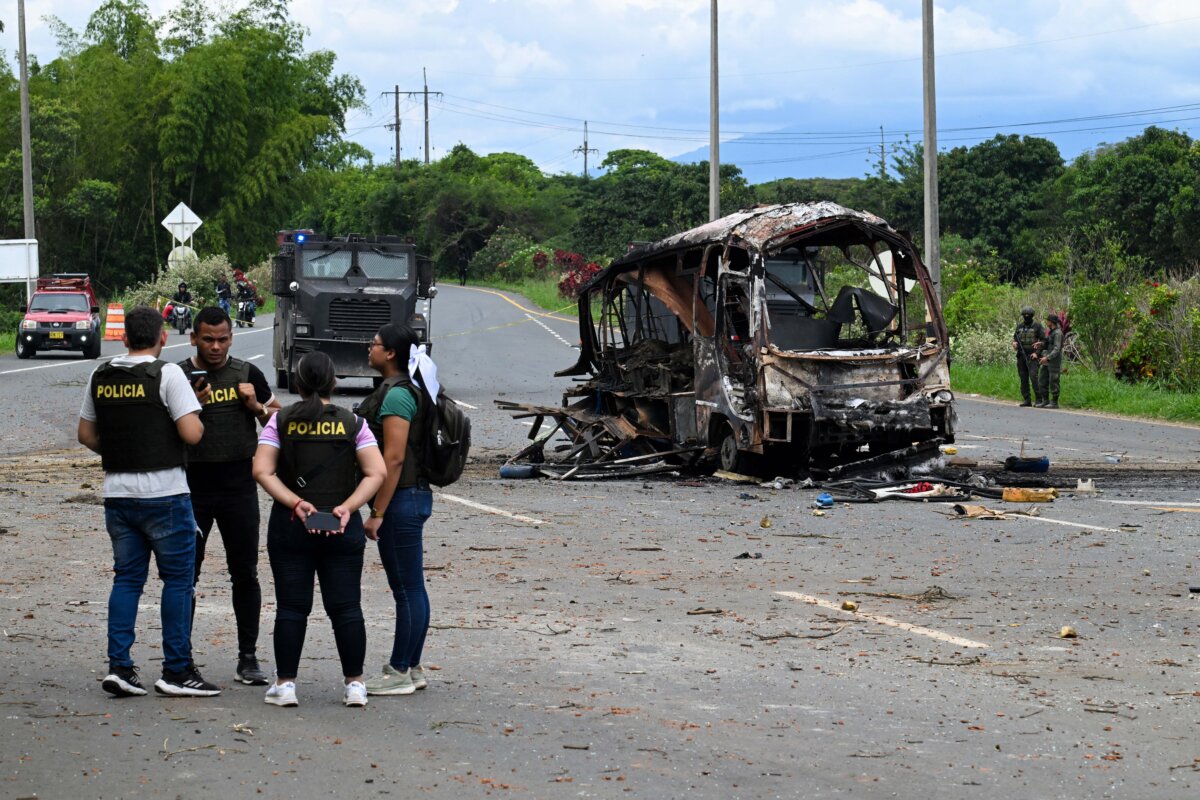 Police officers work at the site where a bus exploded in front of a police station in Villa Rica, Cauca department, Colombia, on June 10, 2025. Southwest Colombia was rocked by a string of explosions and gun attacks that left at least three people dead in what police said appeared to be a coordinated attack designed to sow terror. (Joaquin Sarmiento/AFP via Getty Images)