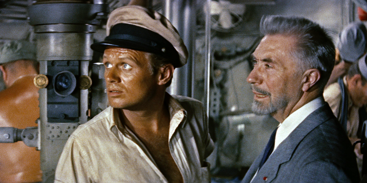 Tense moments for Capt. Adam Jones (Richard Widmark, L) and Prof. Montel (Victor Francen), in “Hell and High Water.” (20th Century Fox)