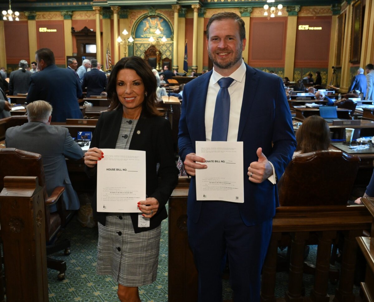 State Rep. Angela Rigas and State Sen. Jon Lindsey show bills to fix a loophole in the campaign finance law. (Courtesy of Michigan House Republicans)
