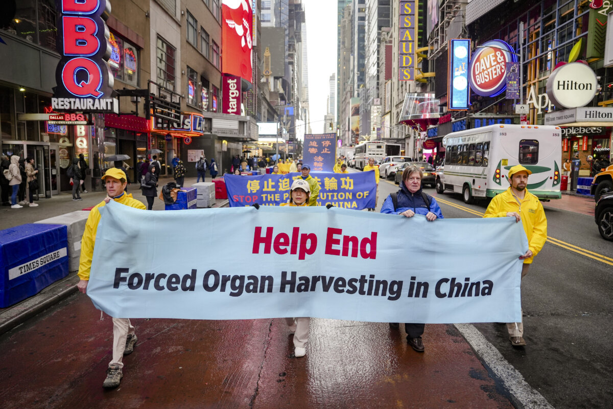 Falun Gong practitioners take part in a parade to celebrate World Falun Dafa Day while calling for an end to the persecution in China, in New York City, on May 10, 2024. (Samira Bouaou/The Epoch Times)