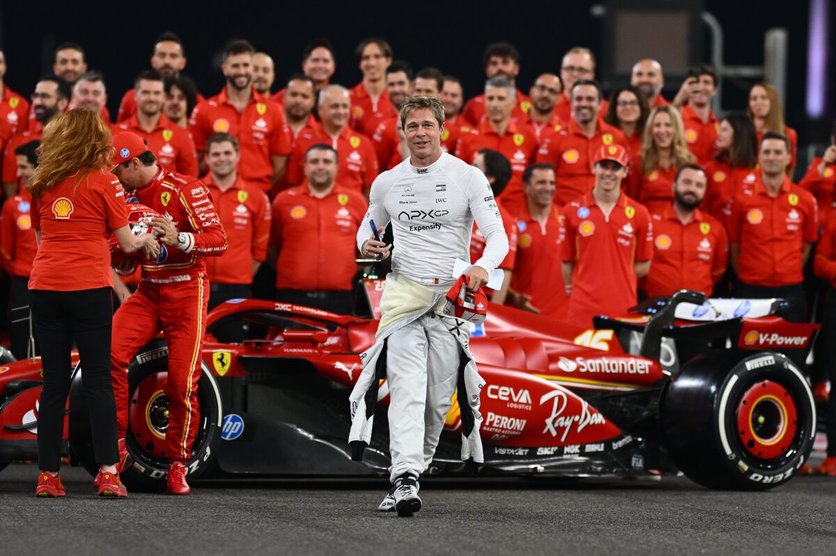 Brad Pitt, star of "F1 The Movie," walks from the Ferrari team photo during previews ahead of the F1 Grand Prix of Abu Dhabi at Yas Marina Circuit in Abu Dhabi, United Arab Emirates, on Dec. 5, 2024. (Clive Mason/Getty Images)