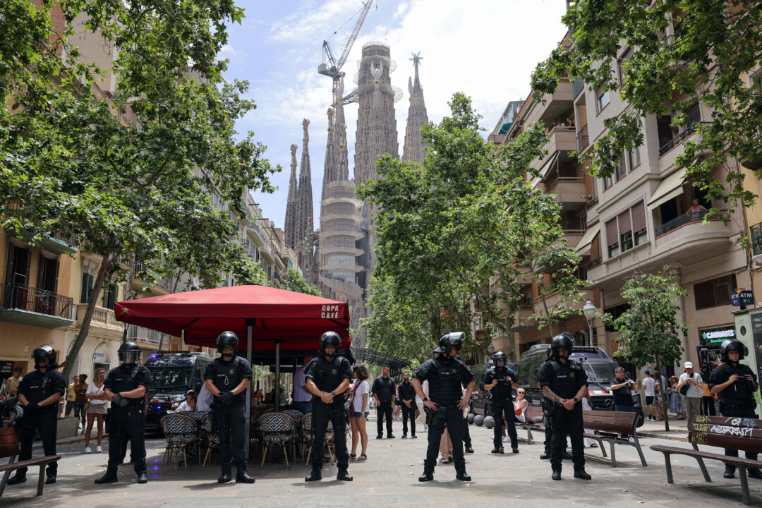 NextImg:Day in Photos: Protests in Spain, First Veterans Day in Germany, Iran-Israel Strikes Continue