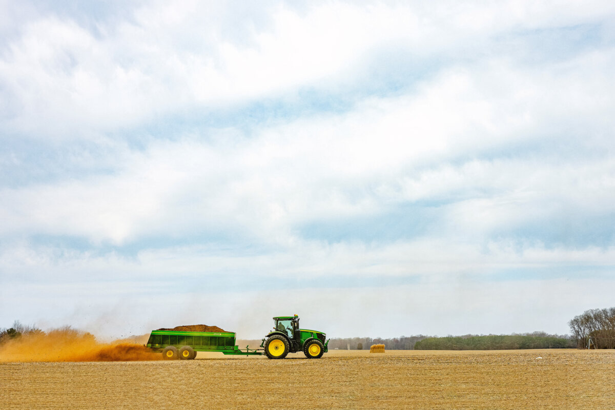 A tractor spreads fertilizer on a field at a farm in Church Hill, Md., on March 20, 2025. (Jim Watson/AFP via Getty Images)