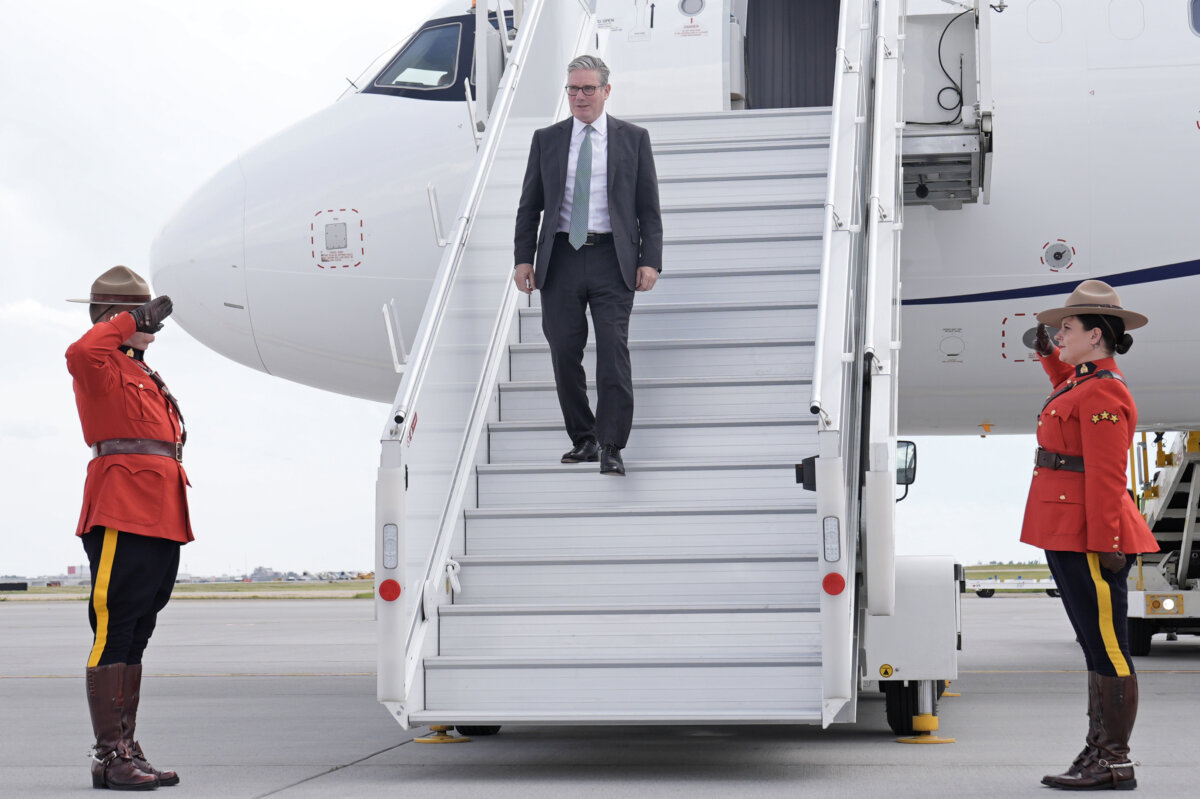 Britain's Prime Minister Sir Keir Starmer disembarks at Calgary International Airport before the start of the G7 summit, in Calgary, Alberta, on June 15, 2025. (Stefan Rousseau - Pool/Getty Images)