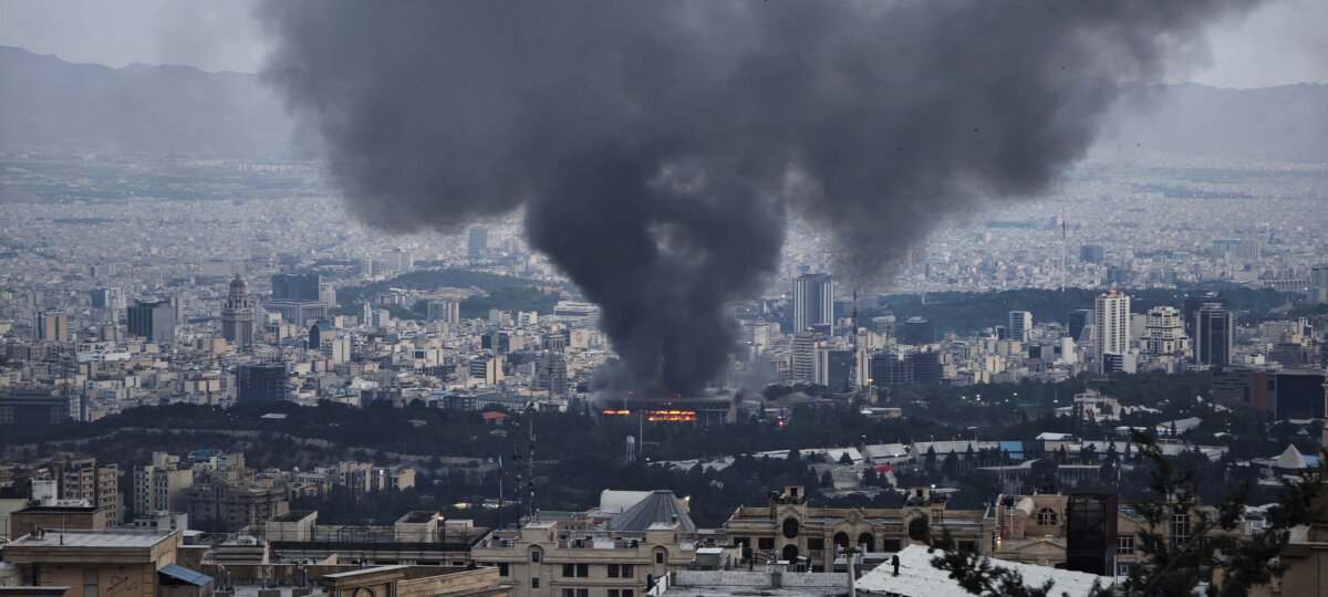 Smoke rises after a reported Israeli strike on a building used by Islamic Republic of Iran News Network, part of Iran's state TV broadcaster, in Tehran, Iran, on June 16, 2025. (Stringer/Getty Images)