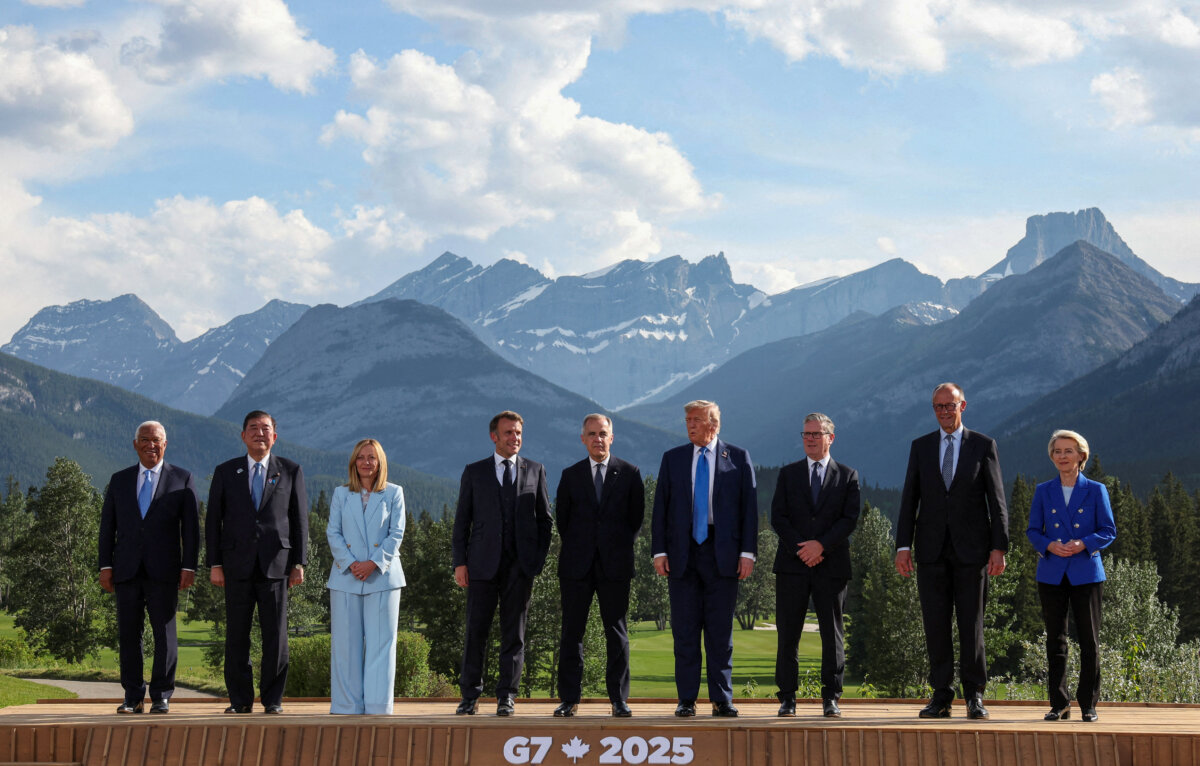 (L/R) European Council President Antonio Costa, Japanese Prime Minister Shigeru Ishiba, Italian Prime Minister Giorgia Meloni, French President Emmanuel Macron, Canadian Prime Minister Mark Carney, U.S. President Donald Trump, British Prime Minister Keir Starmer, German Chancellor Friedrich Merz, and European Union President Ursula von der Leyen pose for a photo during the Group of Seven (G7) Summit at the Kananaskis Country Golf Course in Kananaskis, Alberta, Canada on June 16, 2025. (Suzanne Plunkett/Pool/AFP via Getty Images)
