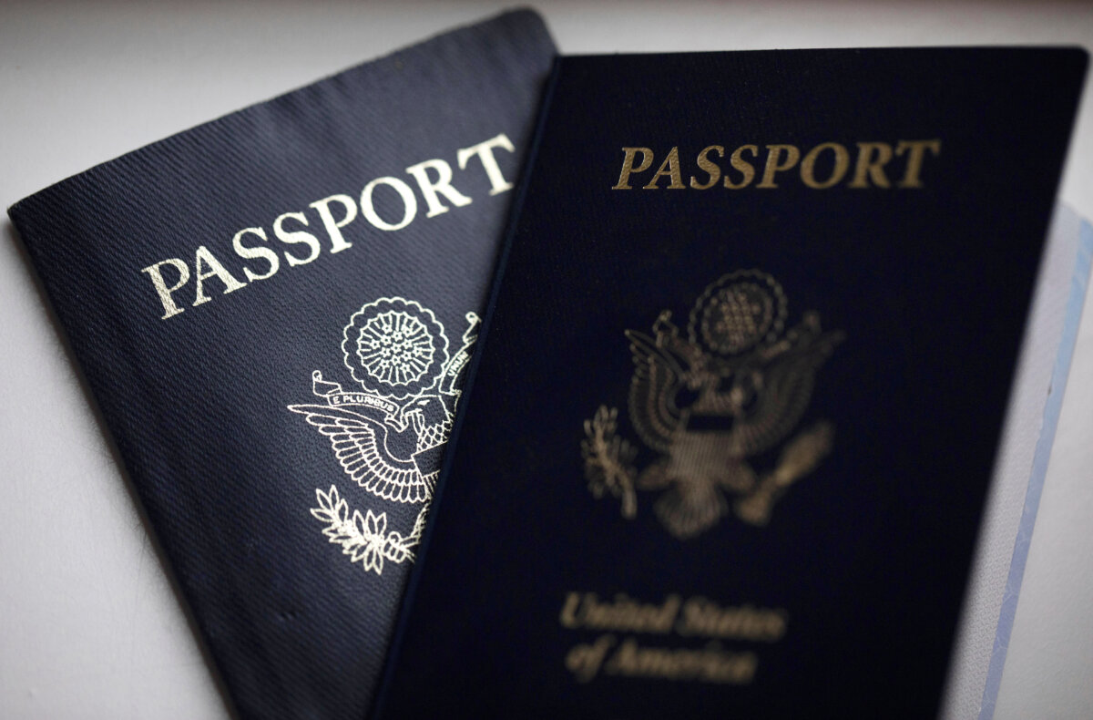 U.S. passports are arranged for a photograph in Tigard, Ore., on Dec. 11, 2021. (Jenny Kane/AP Photo)
