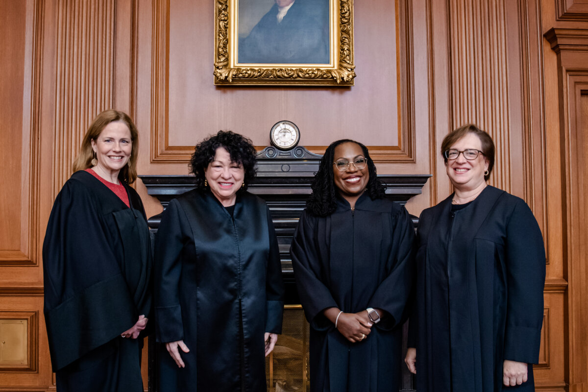 (L–R) Associate Justices Amy Coney Barrett, Sonia Sotomayor, Ketanji Brown Jackson, and Elena Kagan pose at a courtesy visit in the Justices Conference Room before the investiture ceremony of Associate Justice Ketanji Brown Jackson in Washington on Sept. 30, 2022. (Collection of the Supreme Court of the United States via Getty Images)