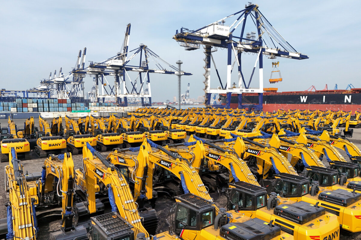 Excavators for export to Africa wait to be loaded on a cargo ship at a port in Yantai, in eastern China's Shandong province, on March 7, 2025. (STR/AFP via Getty Images)