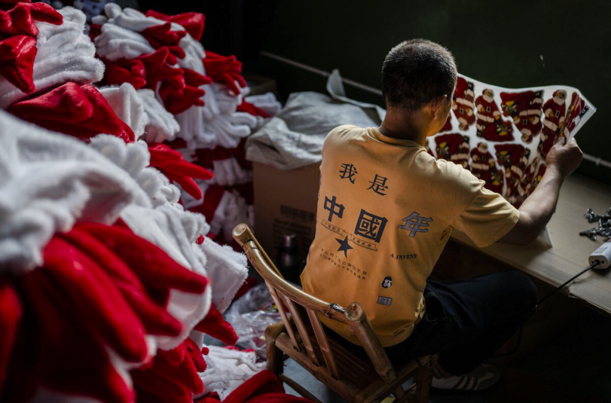 A worker prepares Christmas decorations for export at a factory near Yiwu, Zhejiang Province, China, on April 28, 2025. (Kevin Frayer/Getty Images)
