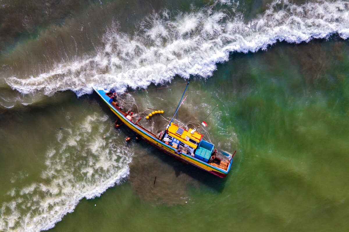 A fishing boat that capsized in rough weather off Banda Aceh, Indonesia, on June 23, 2025. (Chaideer Mahyuddin/AFP via Getty Images)
