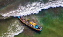 Day in Photos: Ship Capsizes in Indonesia, Forest Fires in Greece, Amazon Launches Satellites